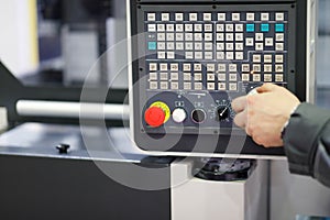 Working with control panel of CNC machining center