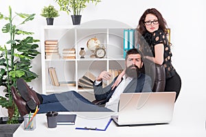 Working couple. Couple of lovers at workplace. Couple in love conducting affair at work. Romantic couple of bearded man