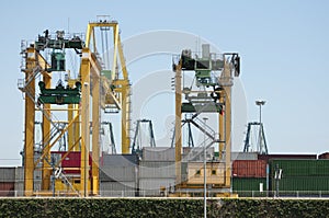 Working crane bridge in shipyard at dusk