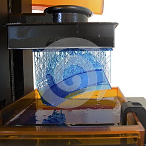 Working 3D printer. Electronic three dimensional printing machine in process