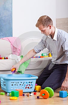 Working daddy cleaning home