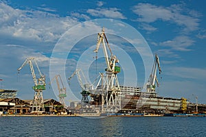 Shipyard, cranes and vessel in Pula