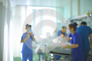 Working doctors in hospital ward, unfocused background