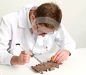 Working electronics repairing board using soldering pen