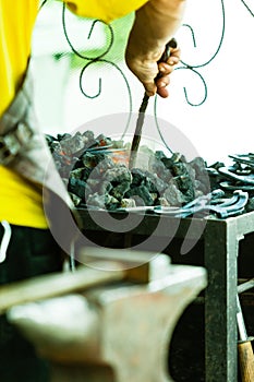 Working forge of the blacksmith in old shop.