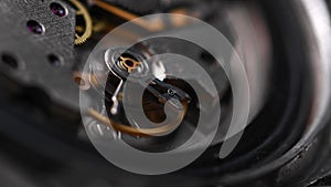 Working gear mechanism of an old wrist watch in macro. Close-up