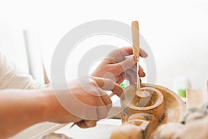 Working hands of craftsman restorer