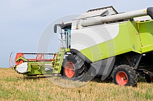 Working harvesting combine in field