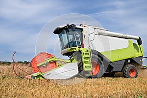 Working harvesting combine in field