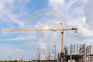 Working at height equipment with bucket liquid concrete container. Construction worker working on a high building. Crane lifting C