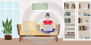 Working from home concept. Woman on the couch with a laptop. Living room interior with wardrobe, window, plant, books