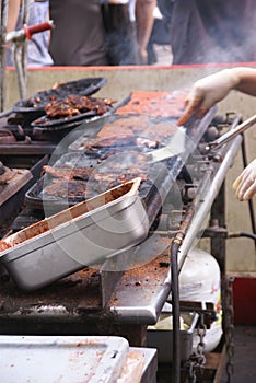 Working a hot grill at Seattle Street Fair,