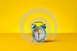 Working hours and overtime work. Hurry work, concept. Clock on yellow background