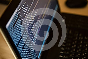 Working hours programming. The programmer prints new lines of HTML