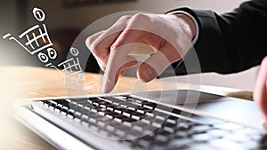 Working on laptop - businessman with tie with shoppingbag photo