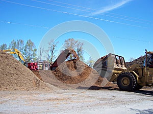 Working machinery at the chip piles