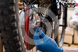 Man in gloves setting gears on a bicycle. Slovakia