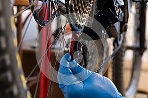 Man in gloves setting gears on a bicycle. Slovakia