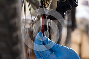 Man in gloves setting gears on a bicycle. Slovakia