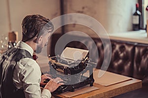 Working man typing on a retro typewriter