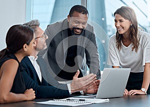 Working on a master plan. Cropped shot of a group of corporate business colleagues having a meeting around the table in