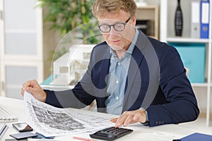 working mature architect in studio