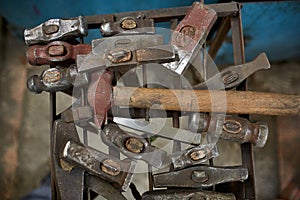 Working metal tools in blacksmith`s workshop, close-up, selective focus, nobody