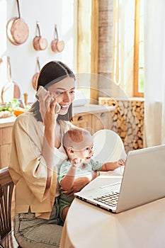 Working mom with baby, multitasking in the morning