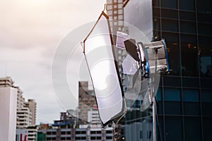 Working movie light. Lighting & Studio in the filming set with a building in the background