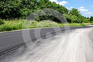 Working on a new asphalt surface of a roadway. much copy space