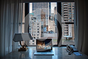 Working office laptop desk with an amazing view to great tall sky scrapers