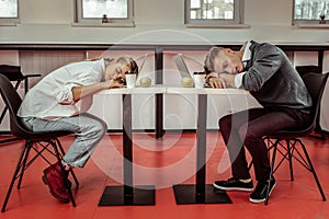 Office workers being extremely tired during active workday photo