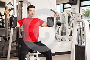 Working out on pec deck machine