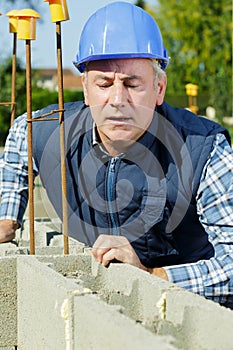 working outdoors on cement wall
