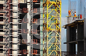 Working people build high-rise building