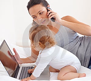 Working, phone call and mom with baby on laptop multitasking in home. Infant, kid and mother busy with computer and