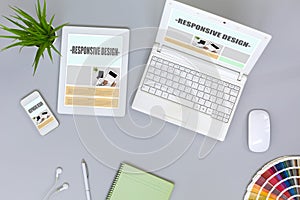 Working Place of web Designer on grey Table top View