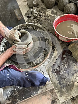 working in a pottery studio