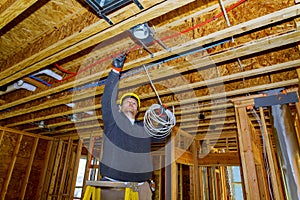 Working process on of electrical wires in installing electrical cable wire in unfinished room