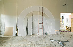 Working process of installing metal frames for plasterboard -drywall - for making gypsum walls in apartment is under