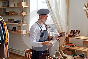 working process of the leather belt in the leather workshop by skilled creative craftsman