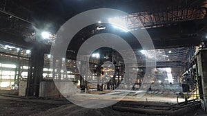 Working process at a metal production factory. The work of an overhead crane at a factory. Crane work at the factory