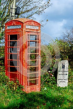 A working red telephone box sits in a layby in Cornwall, England