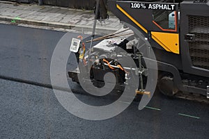 Working with road paving machine