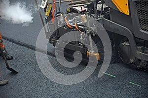 Working with road paving machine
