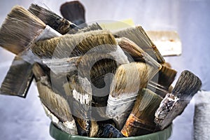 Working set of used natural bristle paint brushes