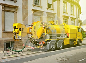 Working Sewage truck working in urban city environment