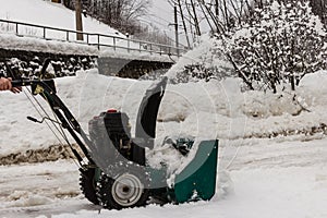 Working with a snowblower, snowblower in action