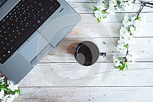 Working space with laptop spring flowers