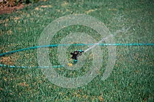 Working Sprinklers for Lawn Irrigation, Moraitika, Corfu, Greece. Small depth of field